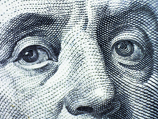 istock Benjamin Franklin's look on a hundred dollar bill. Benjamin Franklin portrait macro usa dollar banknote or bill 2213830033