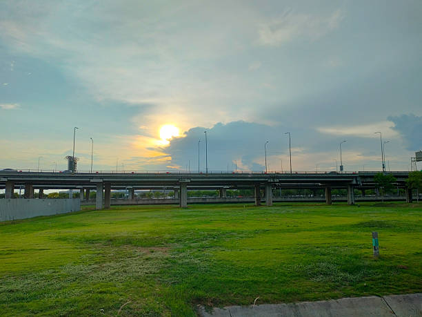 istock Green grass under the bridge in the evening 2213830669