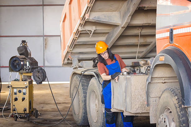 istock Focused Maintenance Beneath Truck 2213831124