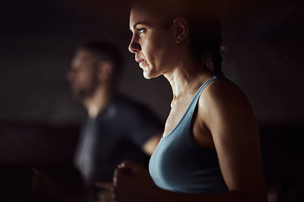 istock Sweaty athletic woman warming up in a gym. 2213832552