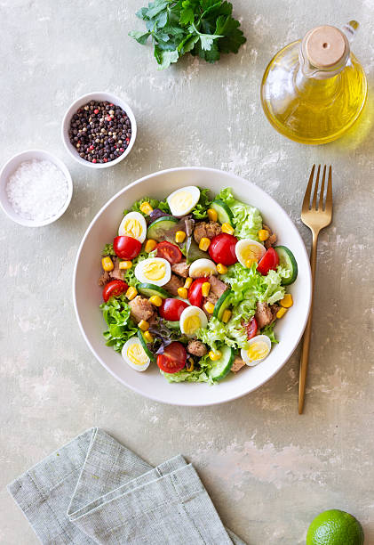 istock Salad with tuna, eggs, tomatoes, cucumbers and corn. Healthy eating. Diet. 2213836493