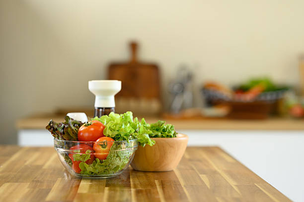 Healthy ingredients for a homemade salad on a kitchen counter.