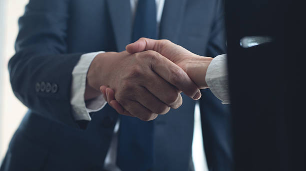istock Businessmen making handshake with partner at office, greeting, dealing, merger and acquisition, successful deal concept, for business, finance and investment background, teamwork, partnership, hand shaking 2213836910