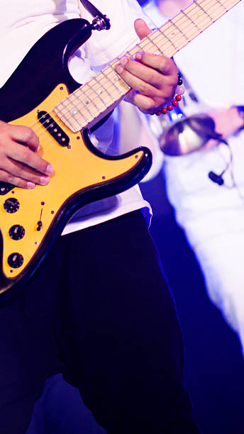 istock Playing black yellow golden guitar 2213837488
