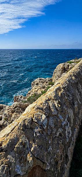istock Cala Romantica Bay in Mallorca with Turquoise Water Cliffs and Dramatic Sky 2213840977