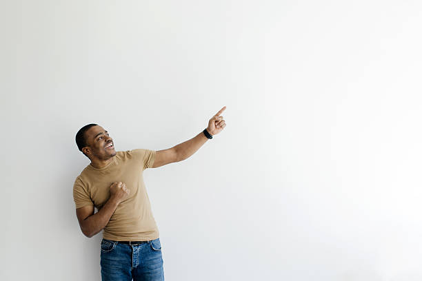 istock Check This. Cheerful African American man pointing aside and looking up with excitement 2213841377
