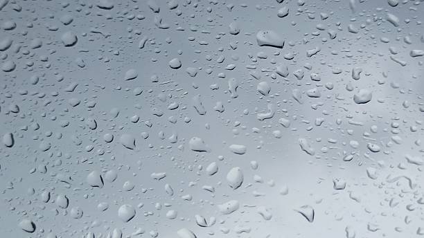 istock view of the clouds from inside the car during drizzle 2213843868