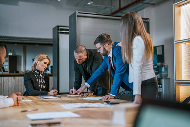 istock Business professionals collaborating during a meeting in a modern office setting 2213845459