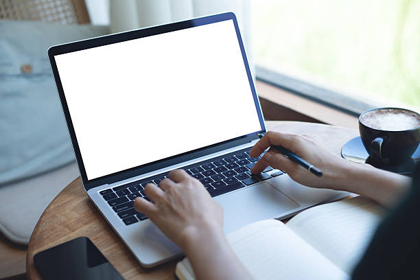istock Mockup blank screen laptop computer. Business woman working on laptop computer at home office, planning work project on notebook. Student studying online via laptop, template for online marketing 2213847796