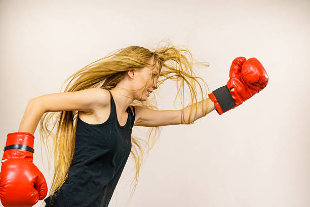 istock Woman in red gloves boxing 2213847907