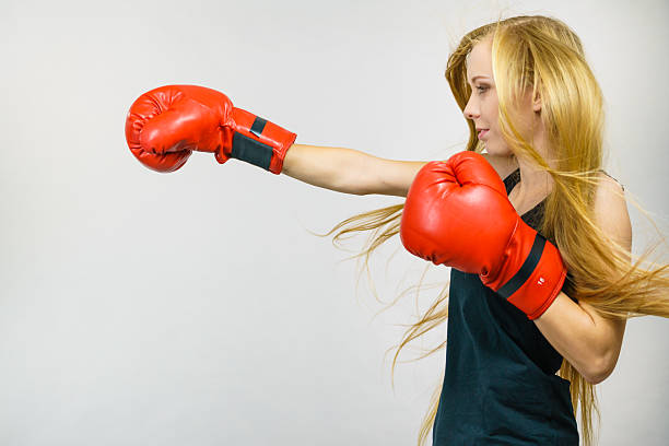 istock Woman in red gloves boxing 2213847943