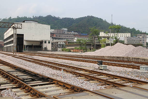istock Railway tracks with a large pile on the right side and a smaller one next to it. 2213850207