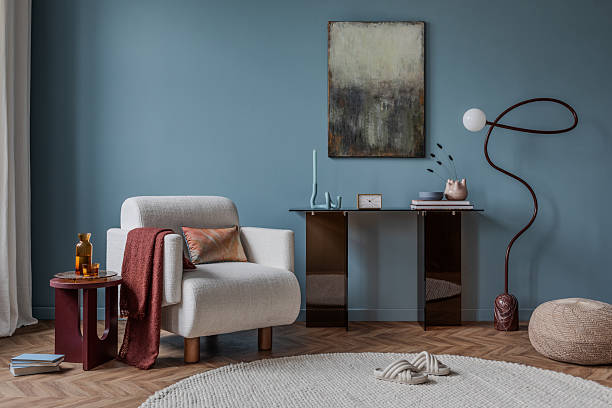 istock A cozy reading corner with a woven chair, soft textiles, and a minimalist console table. Earthy tones and warm lighting create a serene and inviting atmosphere. 2213850958