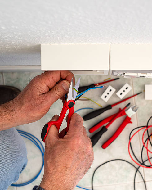 istock Electrician at work on a residential electrical system. Electricity. 2213851839