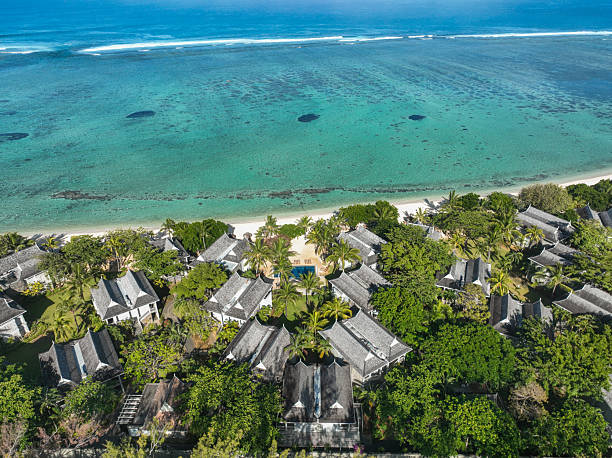 istock Tropical coastline with beachside villas 2213851872