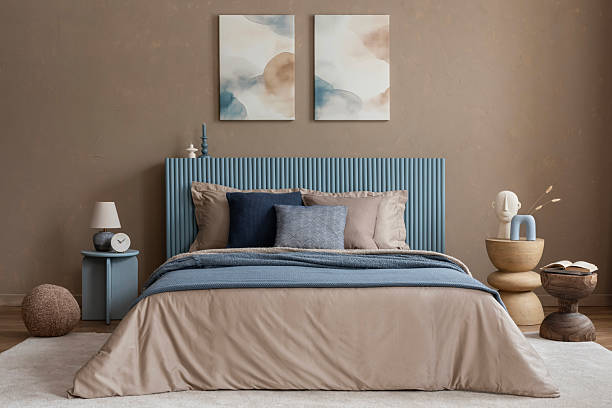 istock A cozy and elegant bedroom setting where layered bedding, natural materials, and abstract artwork create a sophisticated and inviting space. 2213851988