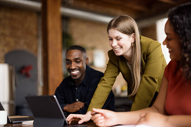 istock Happy entrepreneurs surfing the Internet on touchpad in the office. 2213852392