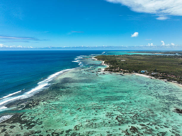 istock Beach with umbrellas and turquoise lagoon 2213852609