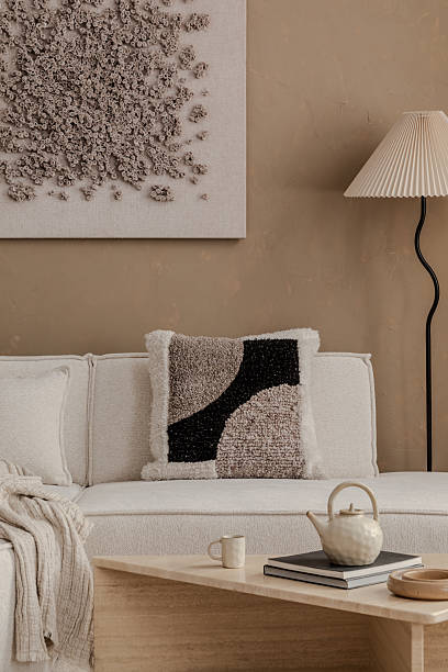 istock A sculptural approach to interior designthis warm, earthy-toned space blends curated objects, natural materials, and soft lighting for a sophisticated yet inviting ambiance. 2213853246