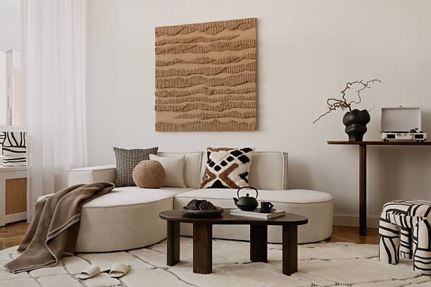 istock Minimalist coffee table styling with a black teapot, nuts, and textured ceramics. A warm and inviting setting for a cozy home. 2213855104