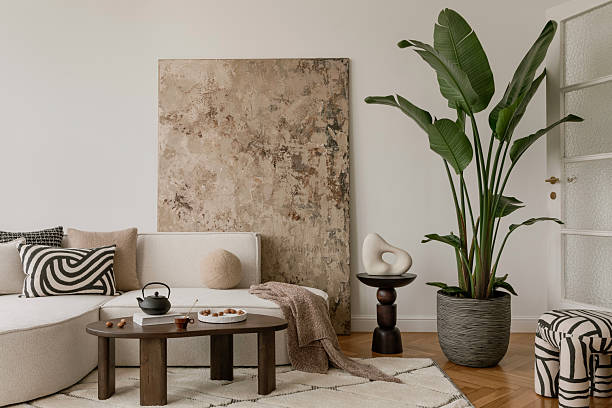 istock Stylish coffee table scene with a ceramic teapot, nuts, and a cozy wool rug. Warm textures and earthy tones for a relaxing space. 2213855124