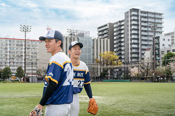 istock Local Baseball Team Members Smiling During Practice at an Urban Field 2213855923
