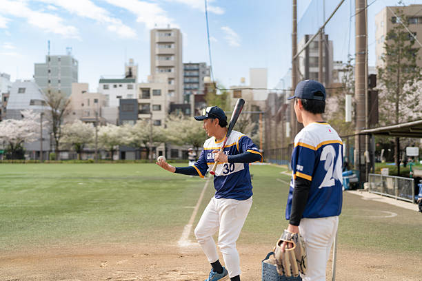 istock Local Baseball Team Practicing Together on a Sunny Afternoon 2213856397