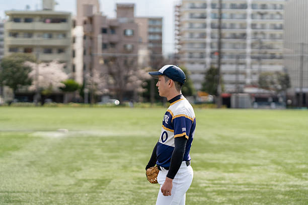 istock Local Baseball Player on Field During a Community Game in Tokyo 2213856398