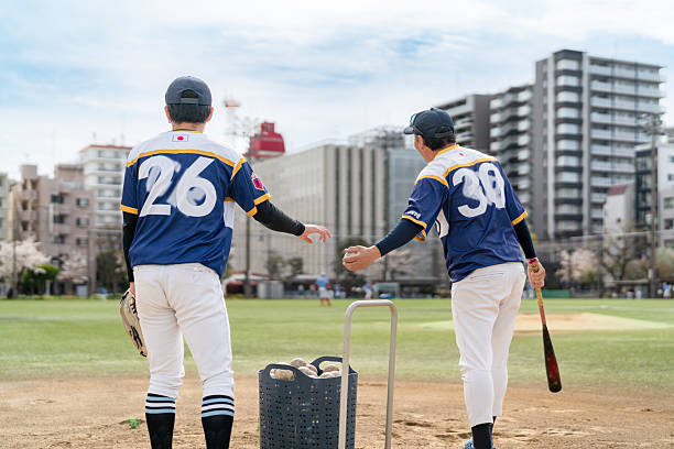 istock Local Baseball Team Practicing with Teamwork in an Urban Community Setting 2213856402
