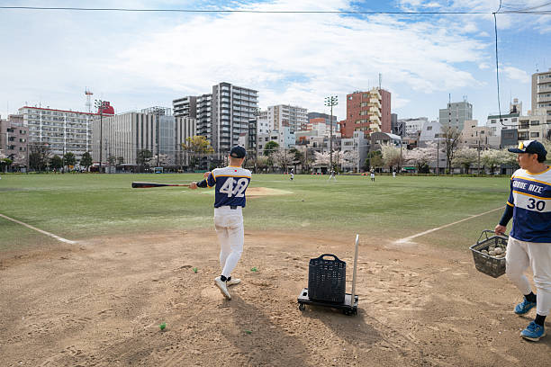 istock Baseball Practice with a Local Team in an Urban Tokyo Park 2213856411