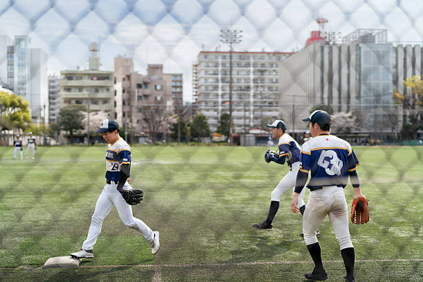 istock Sunny Day Baseball Game with Enthusiastic Team Players in Motion 2213856428