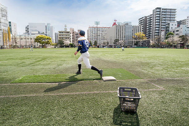 Under the scorching sun, the baseball field was well maintained thanks to the efforts of the groundskeeper. Near second base.