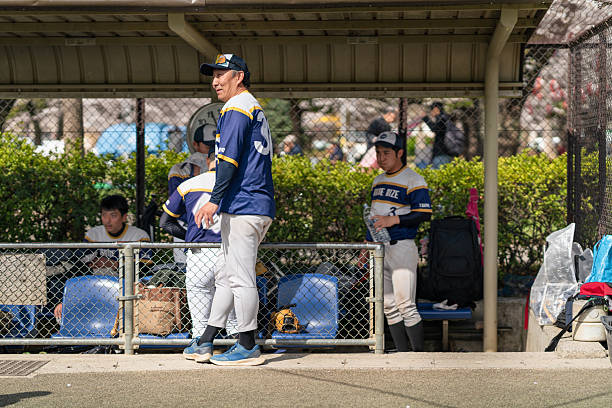young baseball player taking a swing