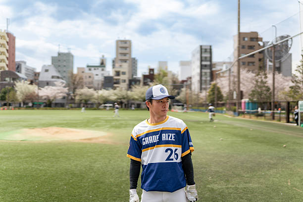 istock Baseball Player on Community Field on Bright Spring Day 2213856896