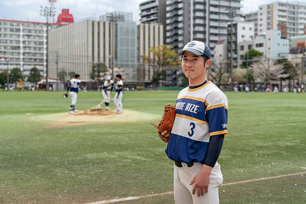 Local Baseball Team Practicing on a Sunny Day at an Urban Park