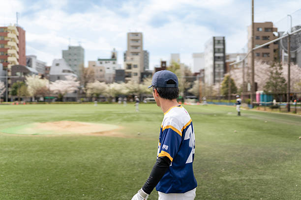 istock Baseball Game Practiced by a Local Team in a Tokyo Park Setting 2213856937