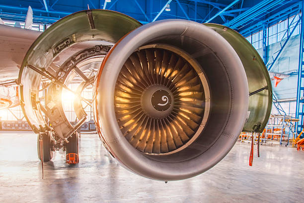 istock View with illuminated blades during repair, jet passenger aircraft engine close up. Maintenance of parts in aircraft hangar. Industrial transportation theme view 2213857767