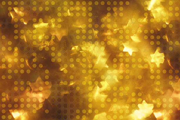 A luxurious abstract background featuring warm golden bokeh lights with star-shaped highlights. The image showcases a rich amber color palette ranging from deep bronze to bright yellow gold. A subtle dot pattern overlay adds texture and dimension to the glowing elements. The soft, out-of-focus light shapes create a dreamy, festive atmosphere perfect for holiday themes. The scattered star shapes suggest celebration and special occasions, while the luminous quality evokes warmth and elegance. This decorative background blends both organic light effects and geometric patterns for a sophisticated yet magical visual experience.