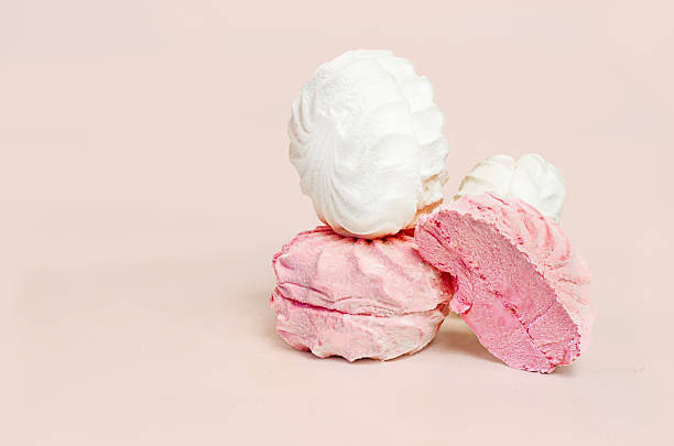 istock Pink and White Zefir Marshmallows on a Pink Background 2213858290