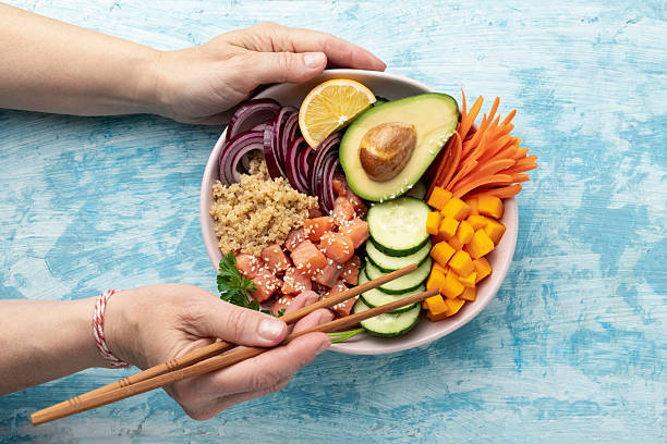 istock poke bowl salmon with quinoa and vegetables 2213858785