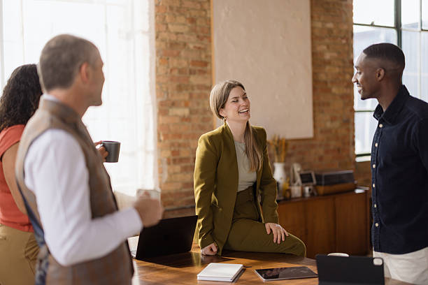 istock Happy business colleagues talking at casual office. 2213859943