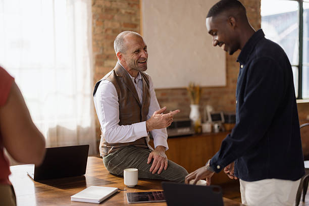 istock Happy businessmen talking at casual office. 2213860804