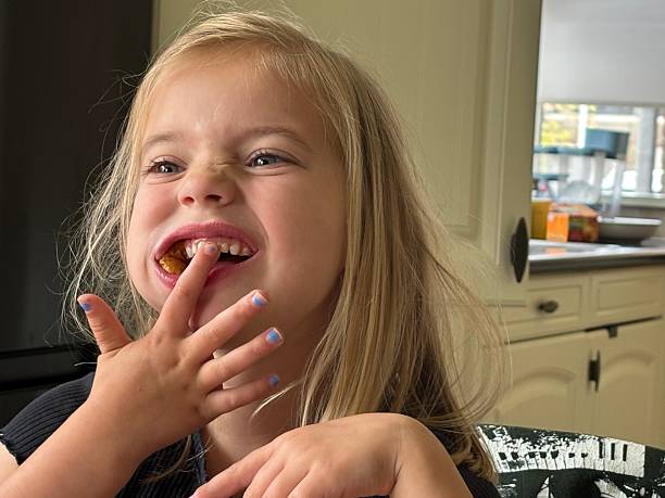 istock Toddler Daughter having Breakfast. 2213861610