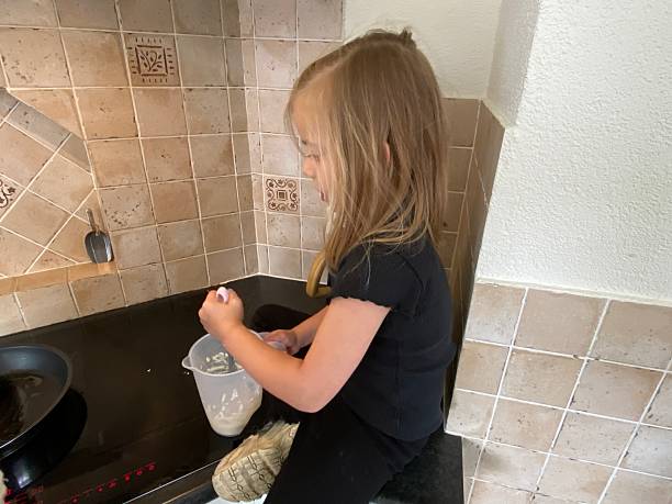 istock Toddler Daughter preparing Breakfast. 2213861907