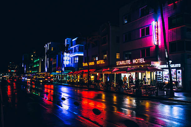 Colorful art deco buildings lit up along Ocean Drive, South Beach, Miami.