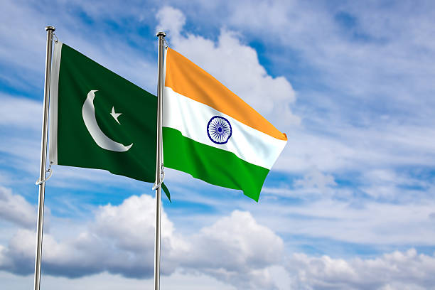 istock India and Pakistan flags waving in the cloudy sky. 2213870851