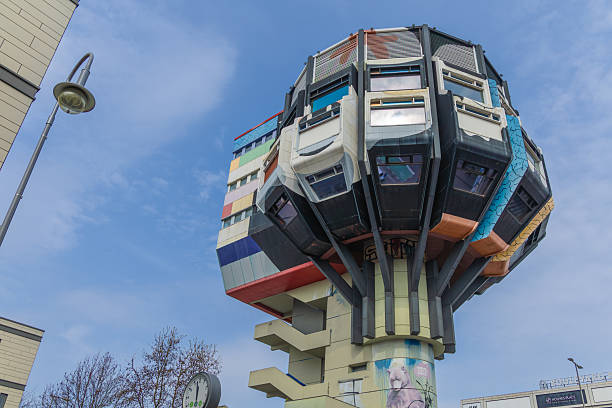 The iconic and colorful Bierpinsel tower in Berlin, Germany, viewed from below against a blue sky with clouds. Berlin, Germany. 29 March 2025.