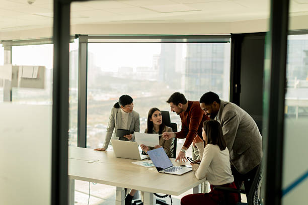 istock Collaboration among diverse professionals in modern office space during a strategic meeting 2213873827