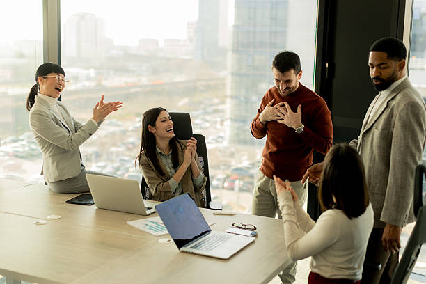 istock Exciting moments of success in a modern office setting filled with celebration and teamwork 2213873836