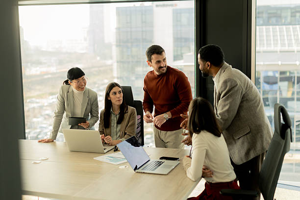 istock Collaboration among diverse professionals in modern office space during a strategic meeting 2213873849
